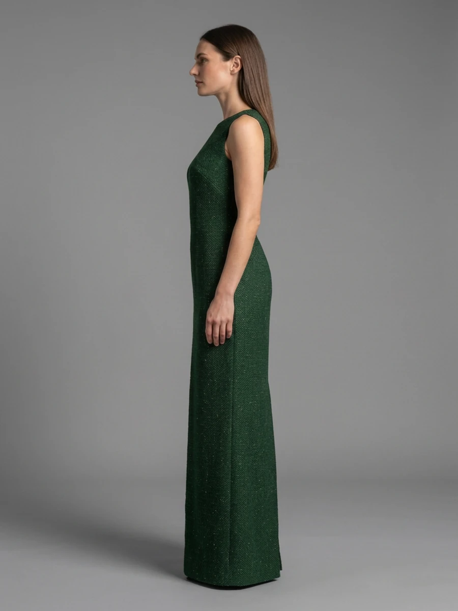 The same model and dress in profile, showing the straight column of the skirt.